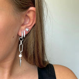 Adora Earrings in silver styled with stacked hoop and heart stud