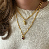 Gold BFF necklace stacked with red Heart Claw Lock Necklace