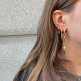 Adora Earrings in gold styled with ear stack and layered spike earrings
