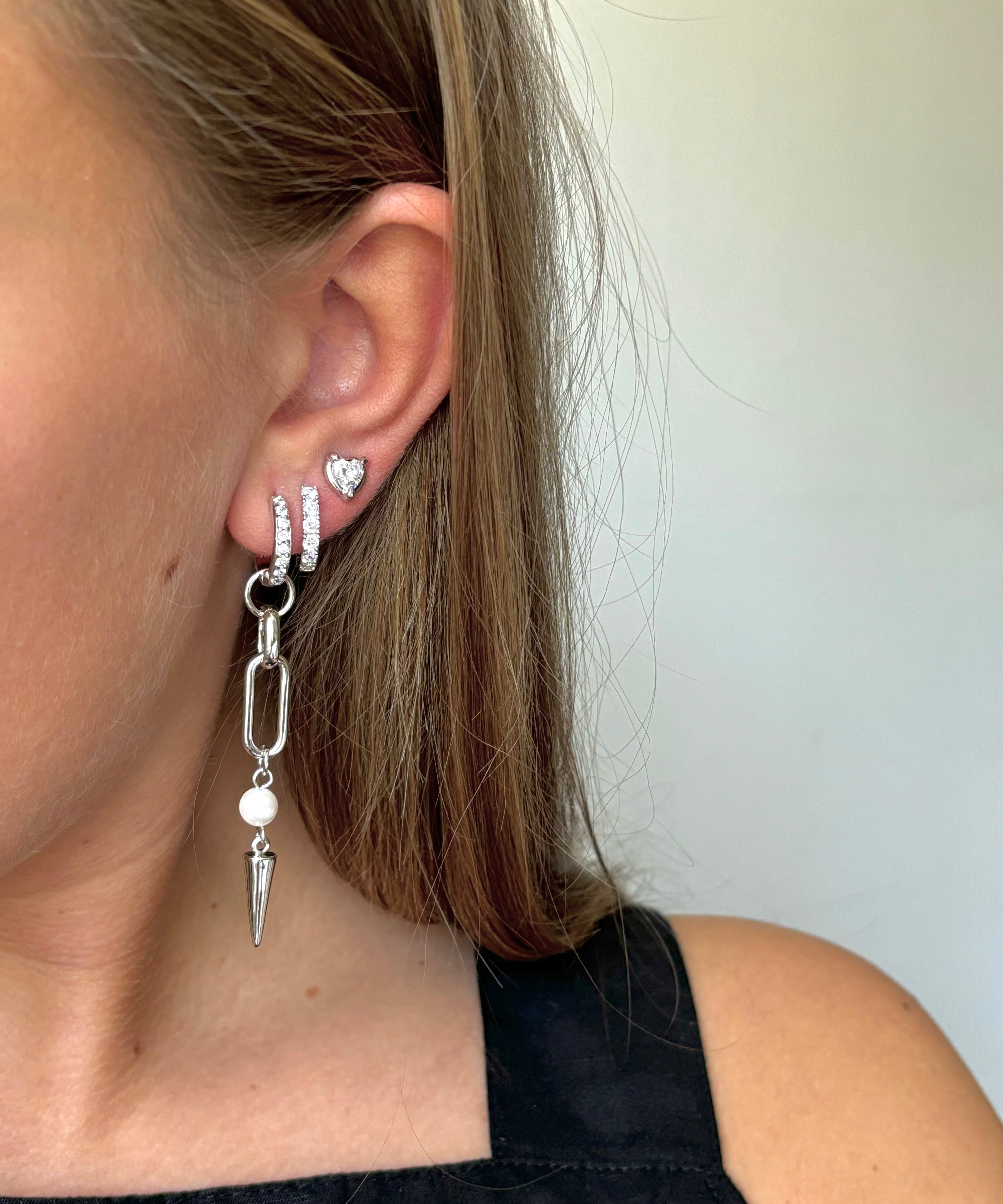 Adora Earrings in silver styled with stacked hoop and heart stud