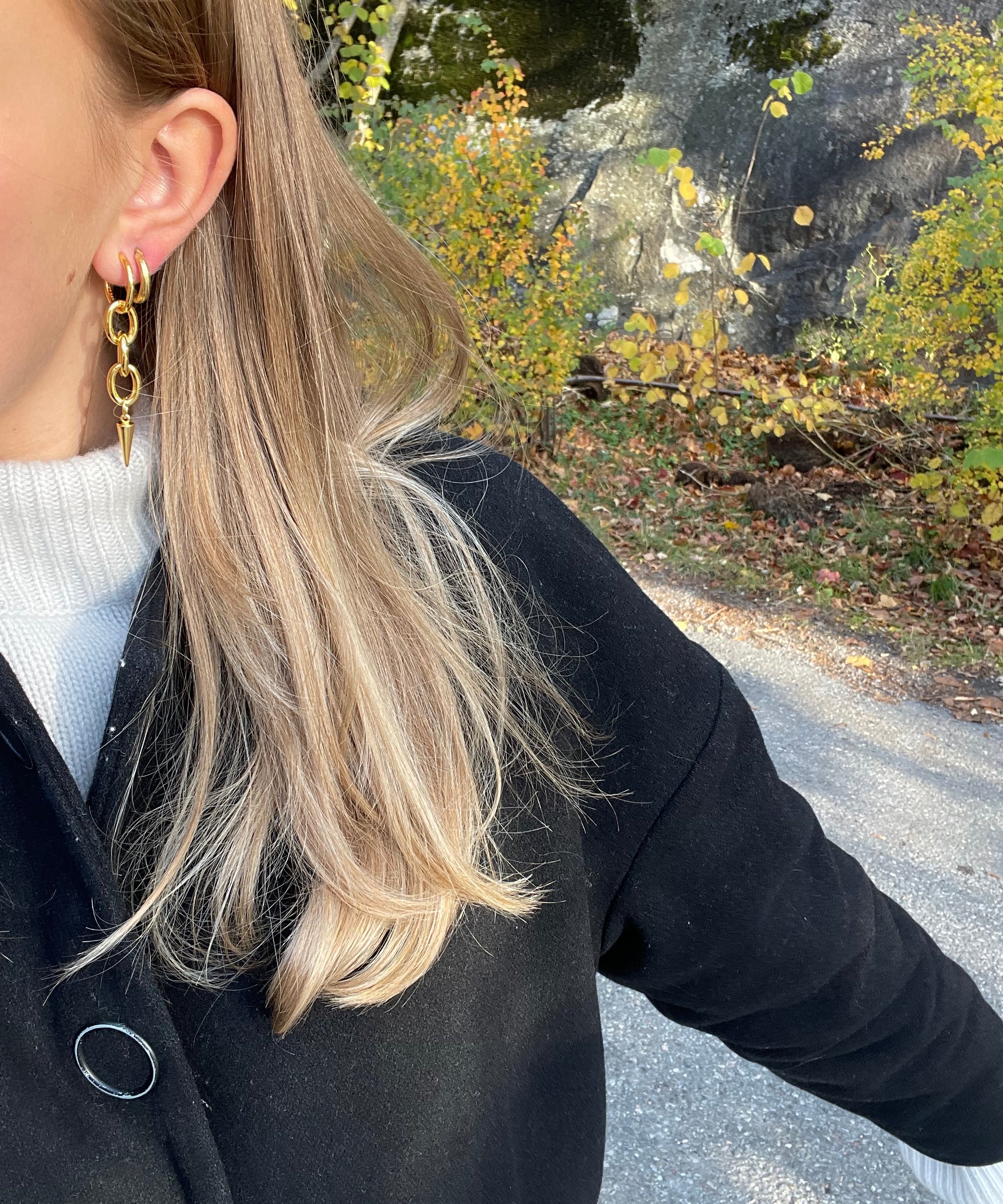 gold alice earrings stacked with hoop earring from side