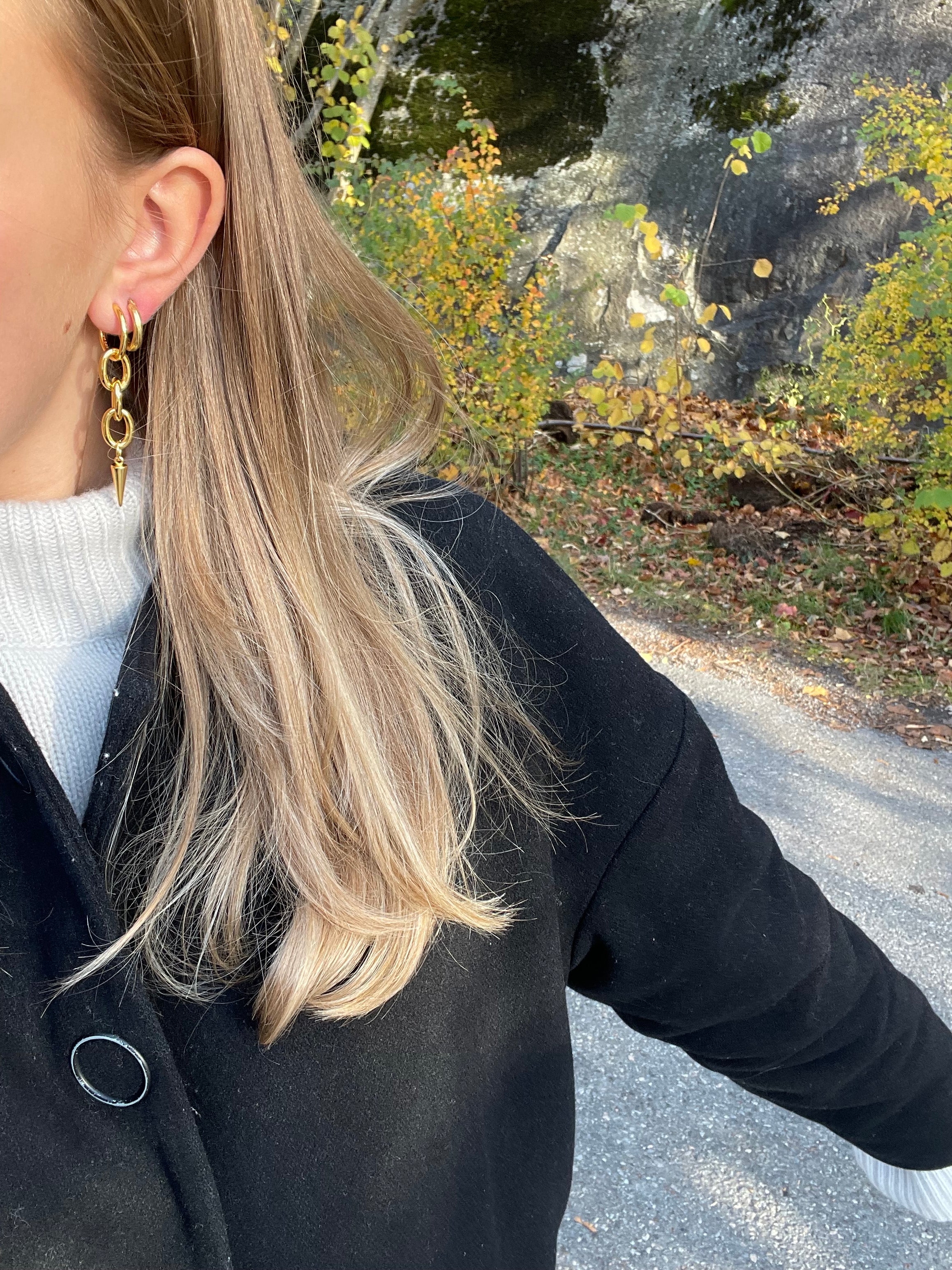 gold alice earrings stacked with hoop earring from side