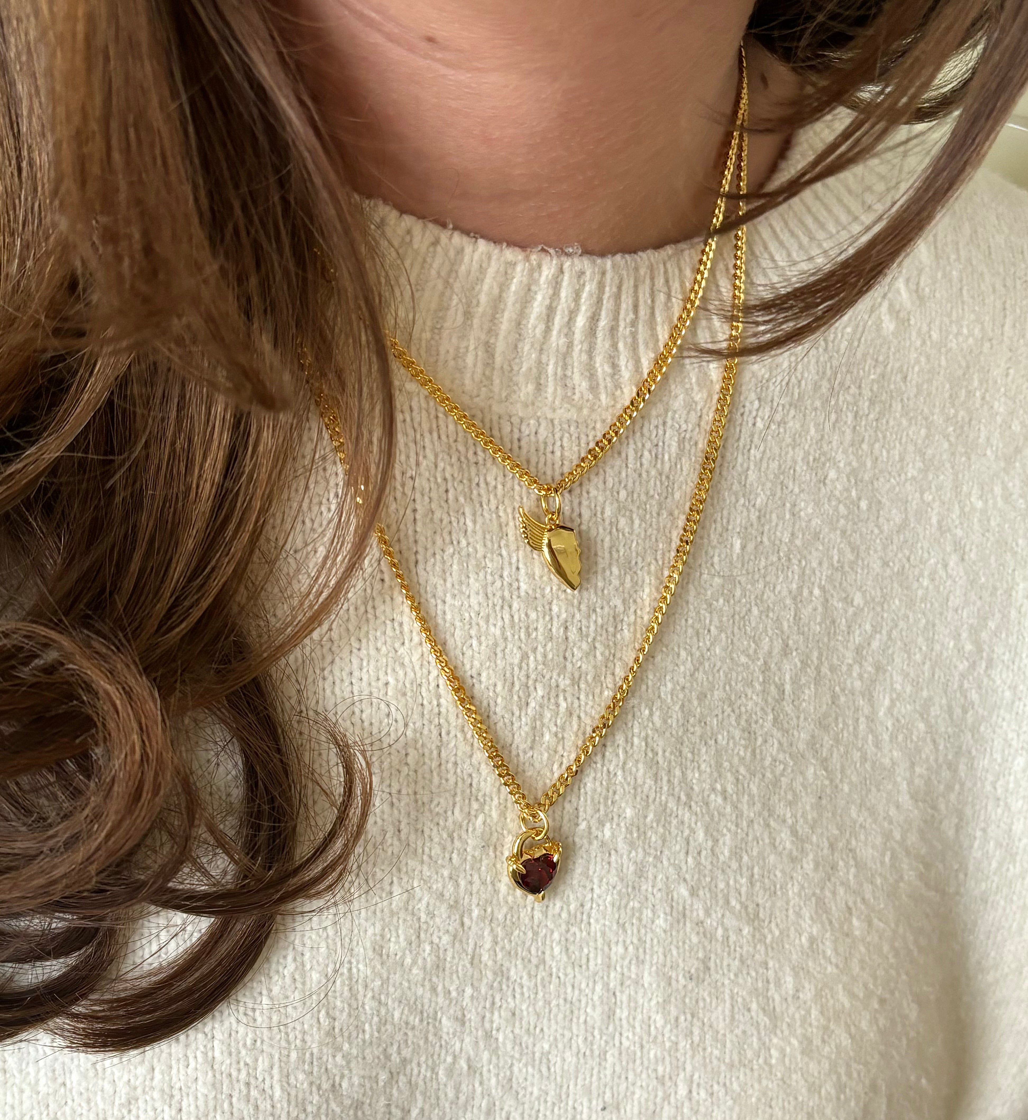 Gold BFF necklace styled with Heart Claw Lock Necklace from front angle