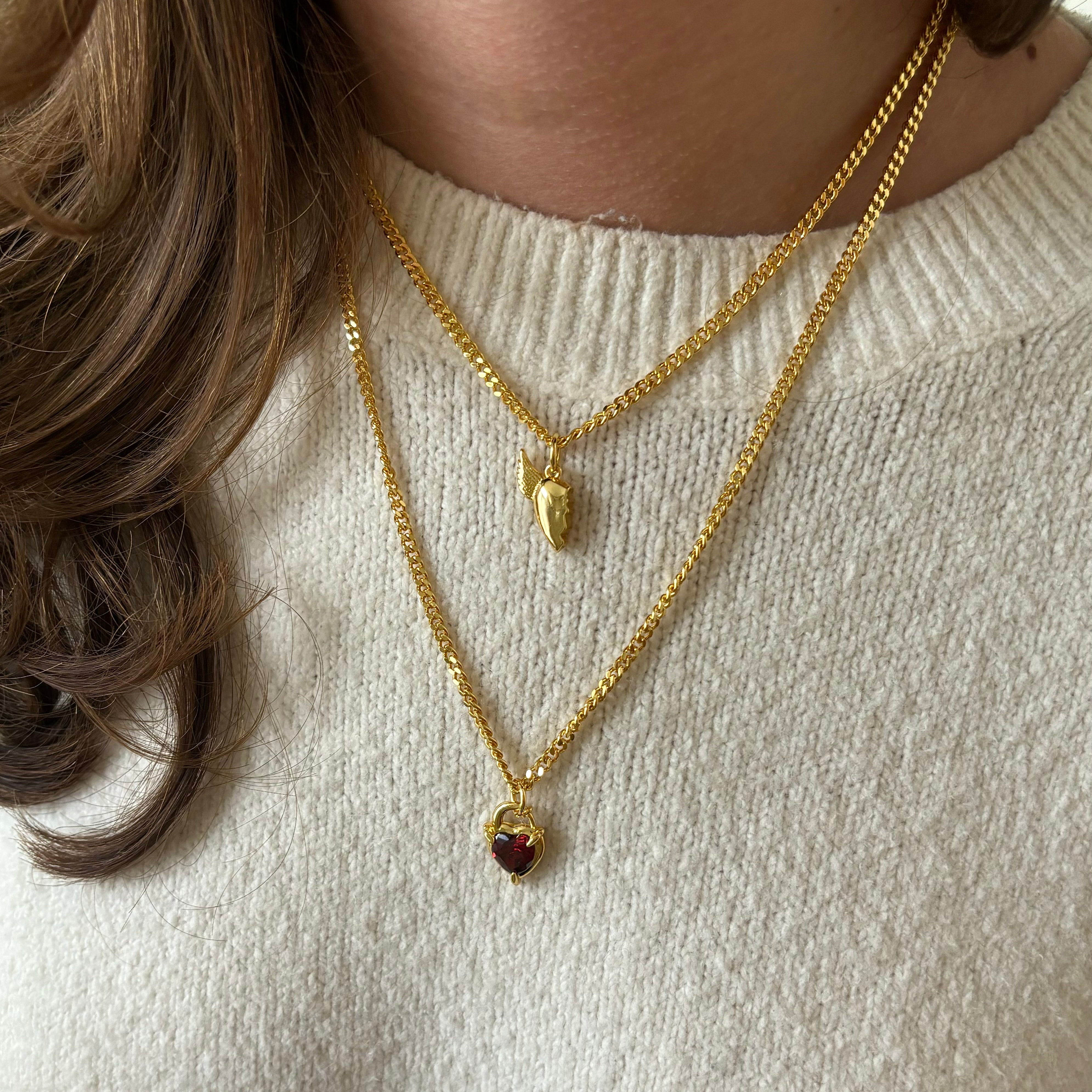 Gold BFF necklace stacked with red Heart Claw Lock Necklace