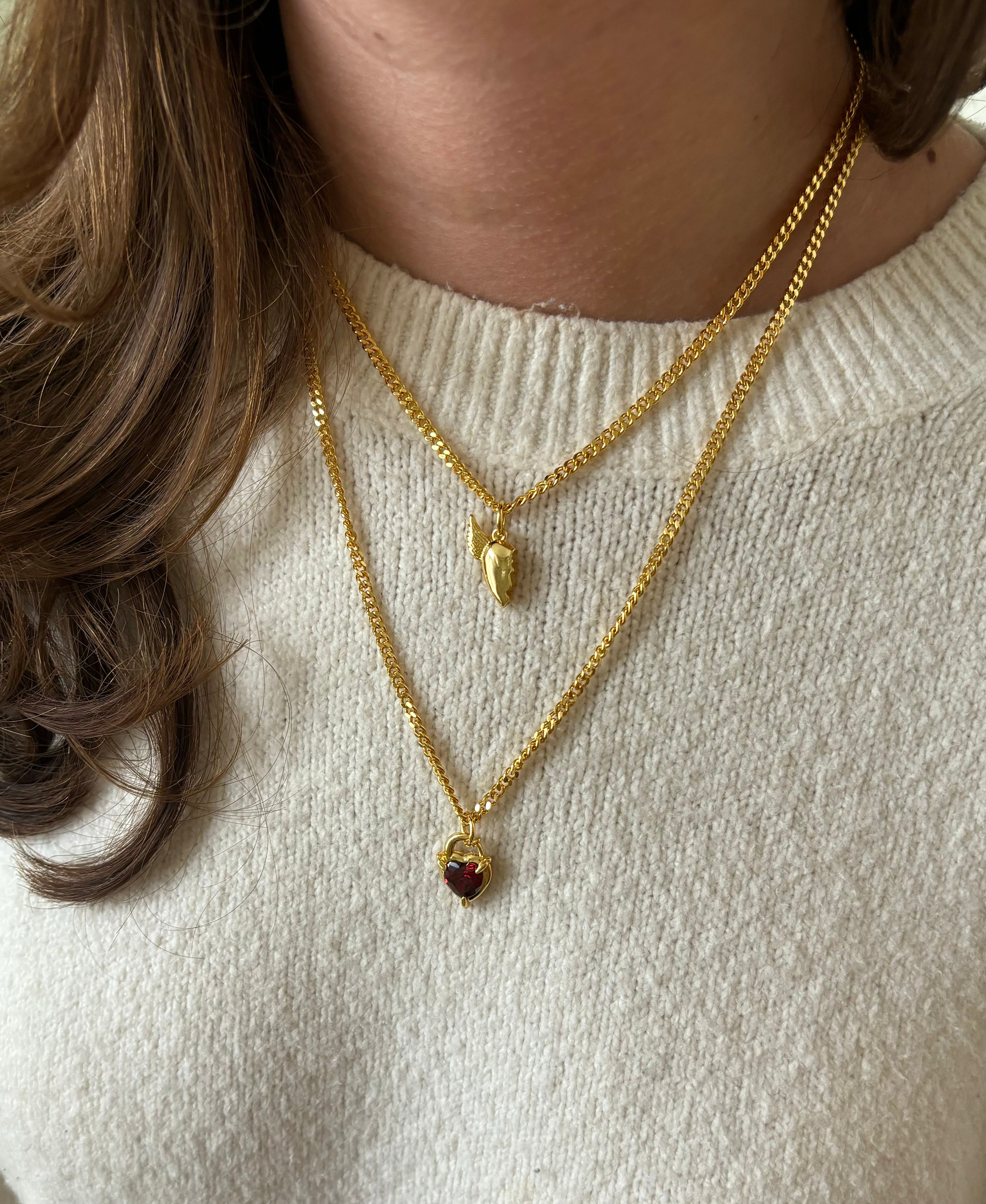 Gold BFF necklace stacked with red Heart Claw Lock Necklace