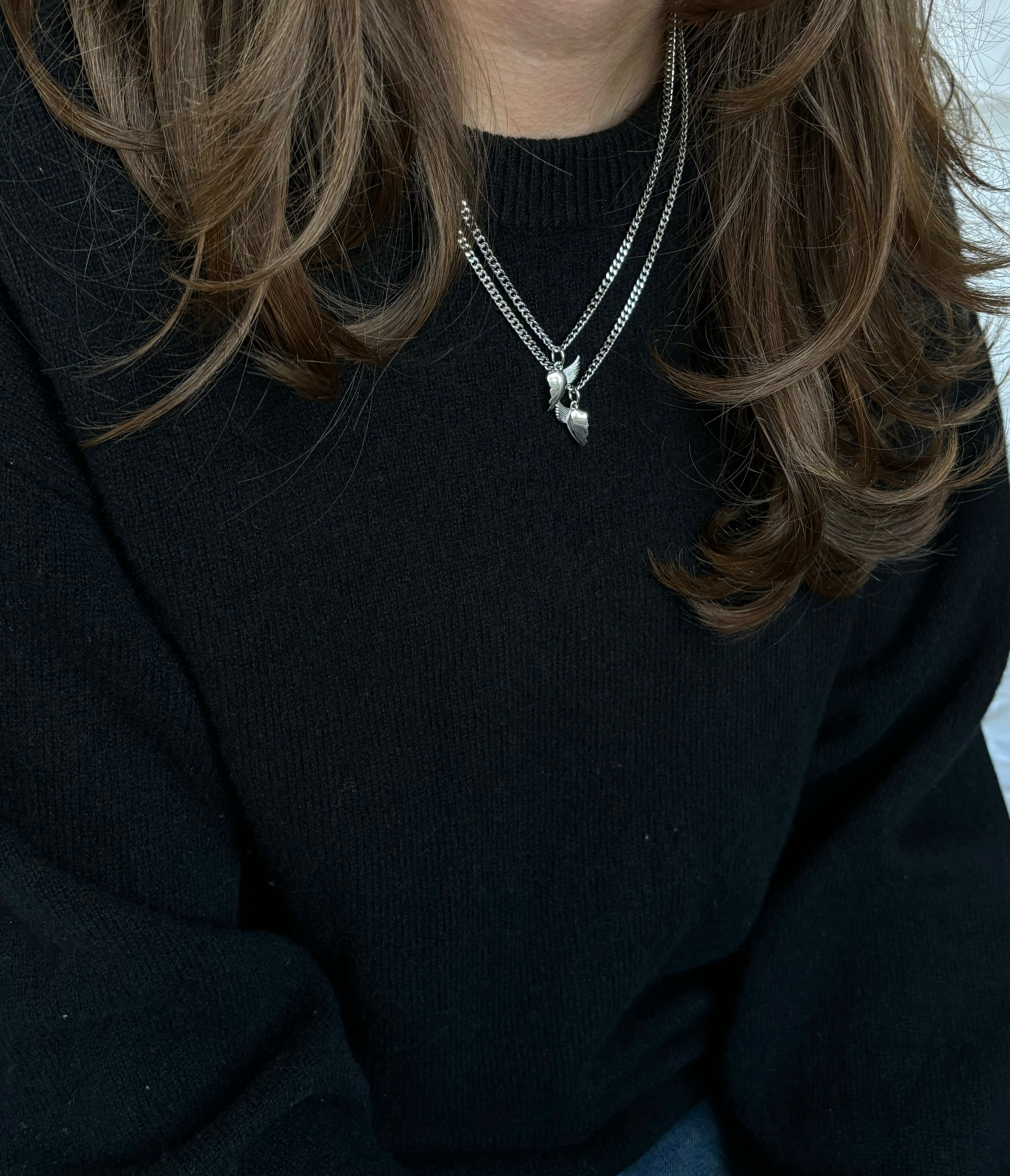 Silver BFF necklace with winged heart pendant styled